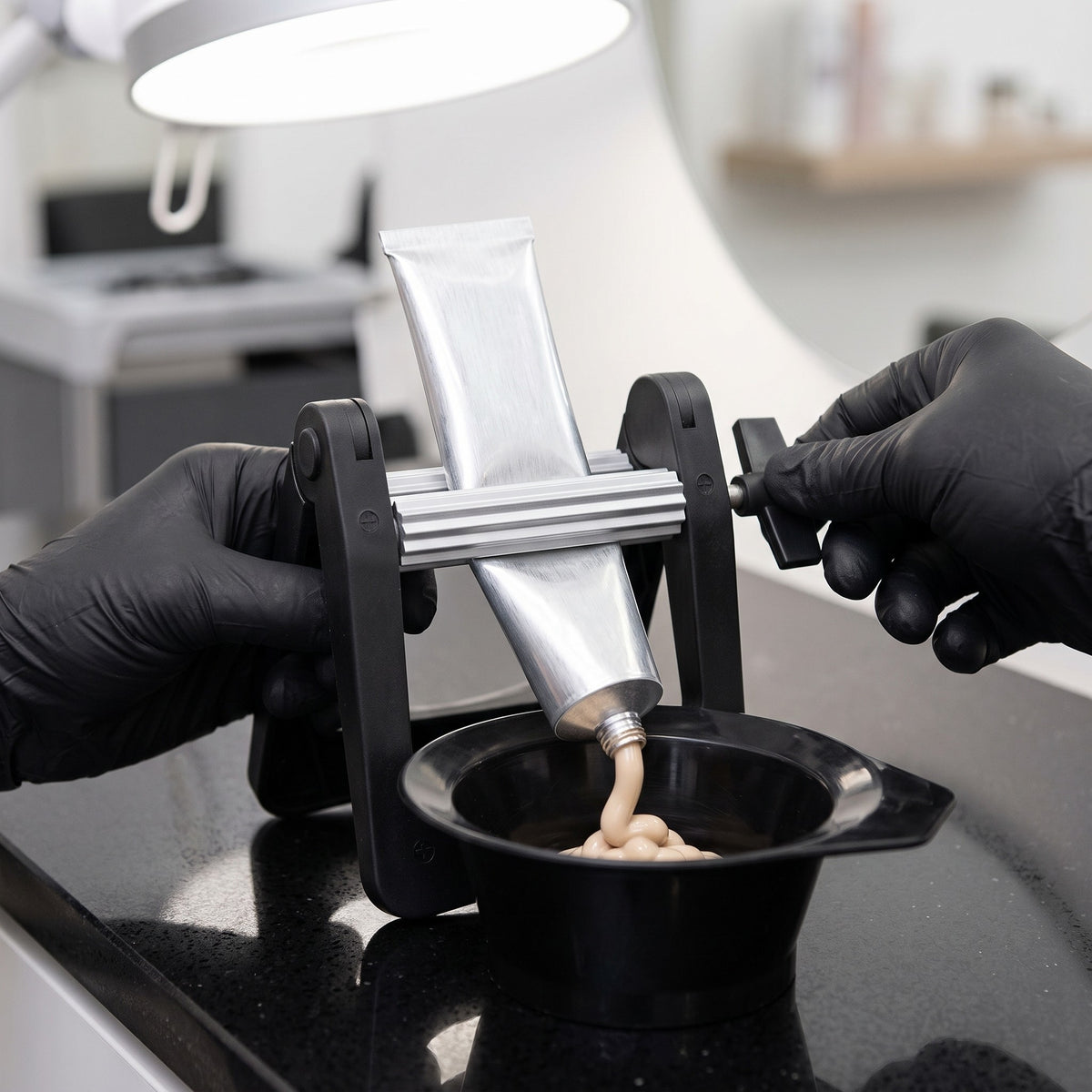 Liang Cai Tint Tube Squeezer in use