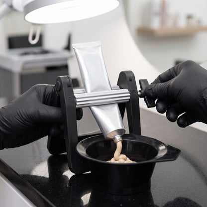 Liang Cai Tint Tube Squeezer in use