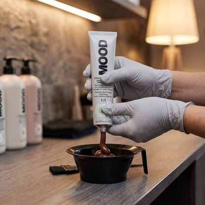 MOOD Color Cream 6.86 Dark Chocolate Blonde 100ml, being mixed and applied in a salon