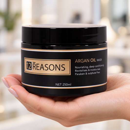 12 Reasons Argan Oil Mask 250ml in its closed black jar, supported in a hand.