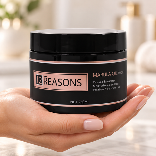 12 Reasons Marula Oil Mask 250ml in its closed black jar, supported in hands.
