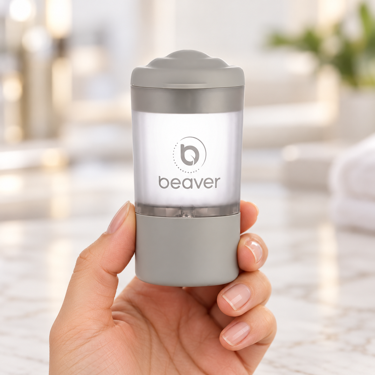 Beaver serum applicator held upright, showing its grey lid and labelled reservoir