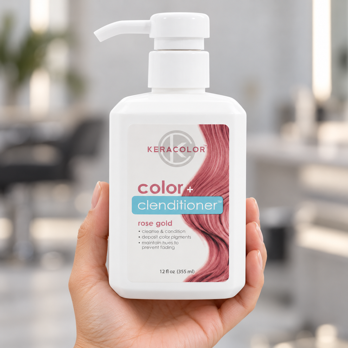Keracolor Rose Gold Color Clenditioner 355 ml bottle held upright in a salon, with the front label visible.