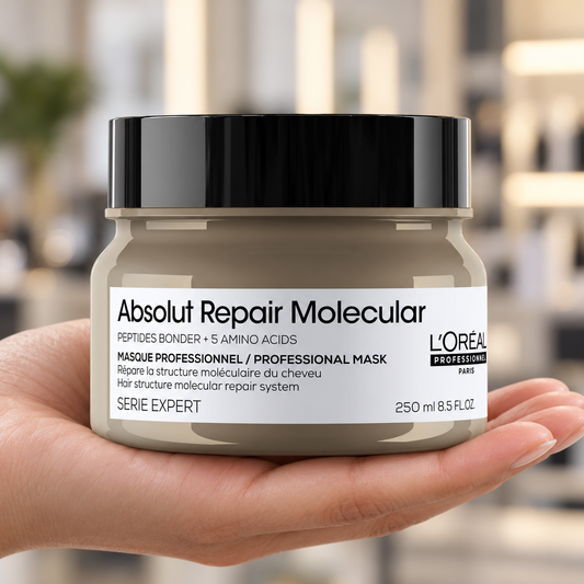 L’Oréal Professionnel Absolut Repair Molecular Mask 250ml held with its label visible.