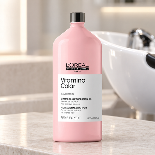 L'Oréal Professionnel Vitamino Color shampoo 1500ml standing beside a salon wash basin