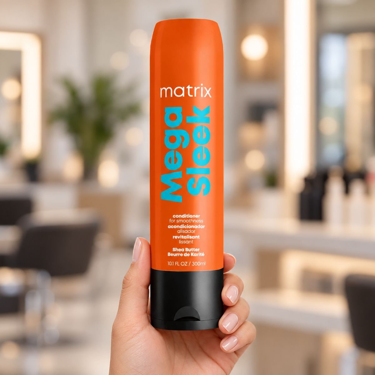 Matrix Mega Sleek Conditioner 300ml held upright with its orange label and black cap visible