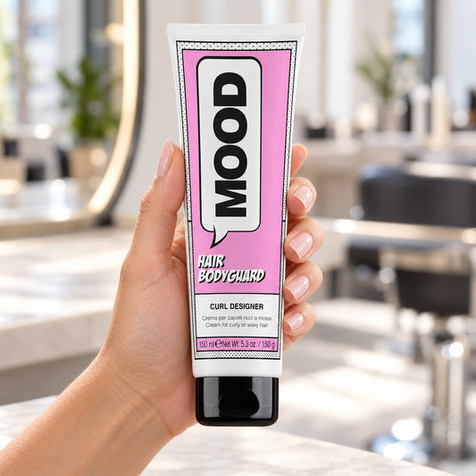 MOOD Hair Bodyguard Curl Designer 150ml tube held upright at a salon workstation