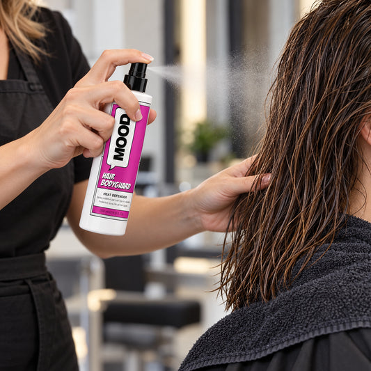 MOOD Hair Bodyguard Heat Defender 200ml being misted onto towel-dried hair before styling