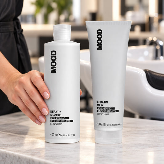 MOOD Keratin Shampoo 400ml and Mask 300ml at a salon basin, with a stylist holding the shampoo
