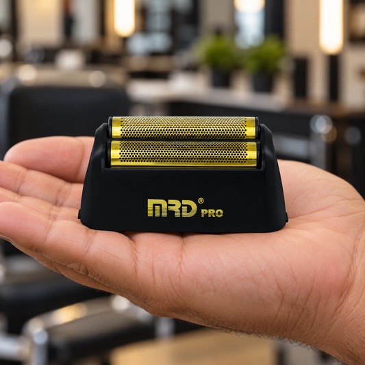 Black MRD Pro Vector replacement foil head supported by a hand, showing the two gold-coloured foils.