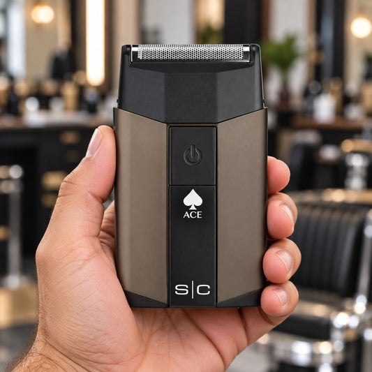 StyleCraft Ace single-foil shaver held in a hand, showing the foil and front power button