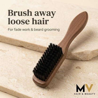 Wooden mini fade brush on pale stone with Brush away loose hair and For fade work and beard grooming captions, plus small blended MV logo. AI-created product presentation.