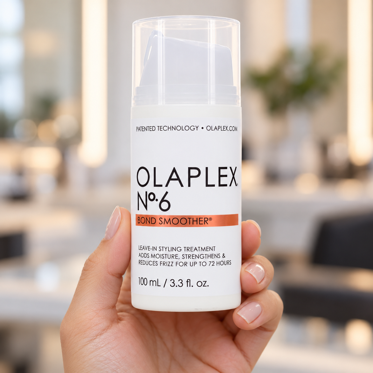 OLAPLEX No.6 Bond Smoother 100ml bottle held upright with its cap on.