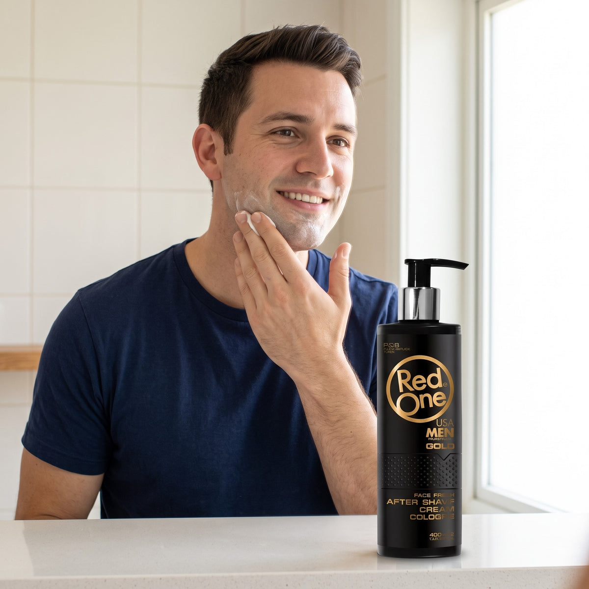 Man applying RedOne Gold After Shave Cream Cologne at a mirror