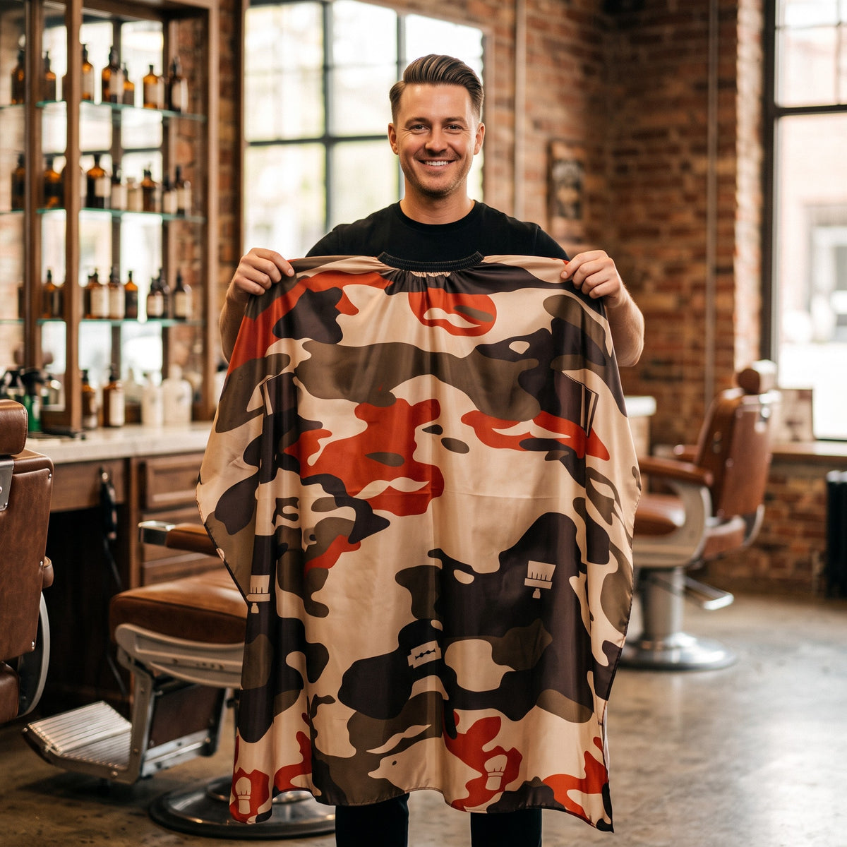 Barber holding up the RedOne Groom Army camo cape
