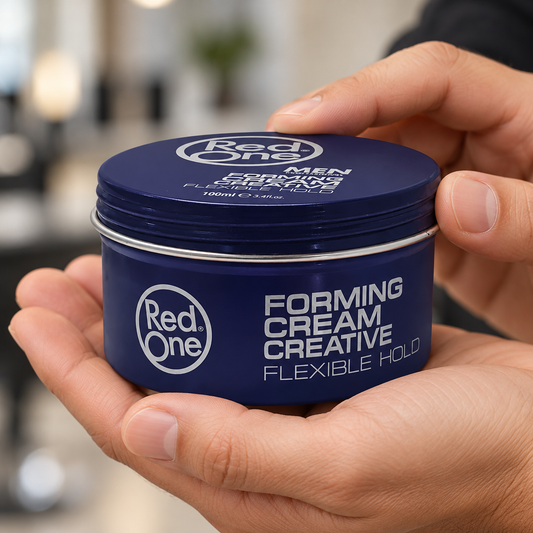RedOne Creative Hair Forming Cream 100ml closed tin held in hands, showing the screw lid and printed front.