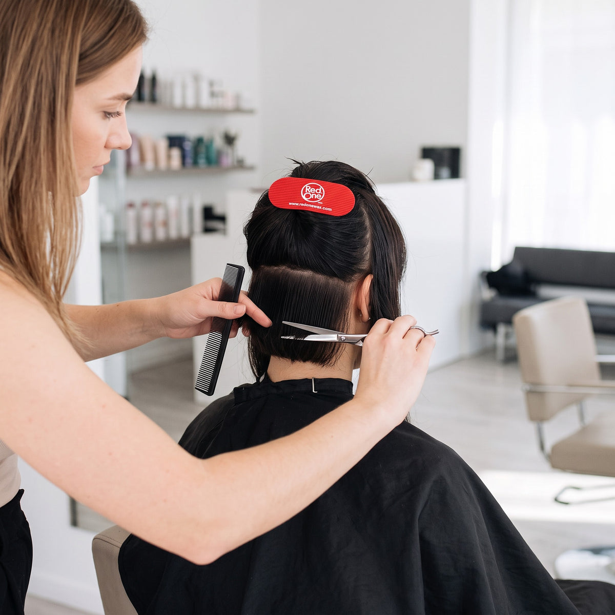 RedOne Hair Grip in red being used to section hair