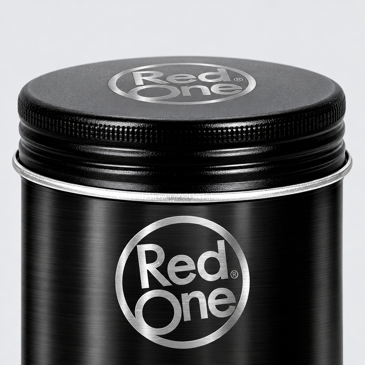 Close-up of the ribbed screw lid and metal rim on RedOne Matte Hair Wax Black 100ml.