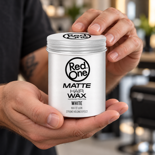 Hands holding the closed RedOne Matte Hair Wax White 100ml tin.