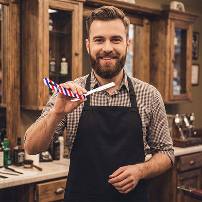 Barber holding a RedOne barber-pole straight razor in a barbershop