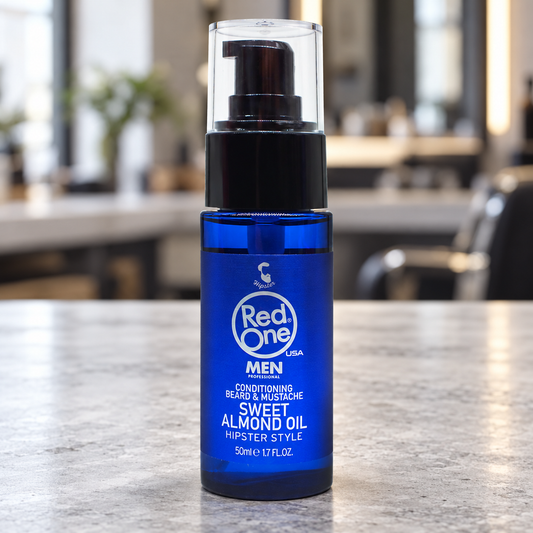 RedOne Sweet Almond Beard Oil 50ml displayed on a light salon counter.