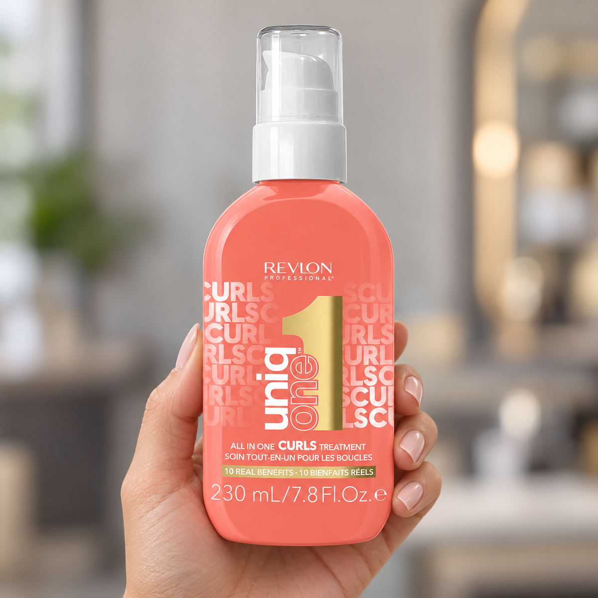 Revlon Professional Uniq One All In One Curls Treatment 230ml held in a salon, with the product label visible.
